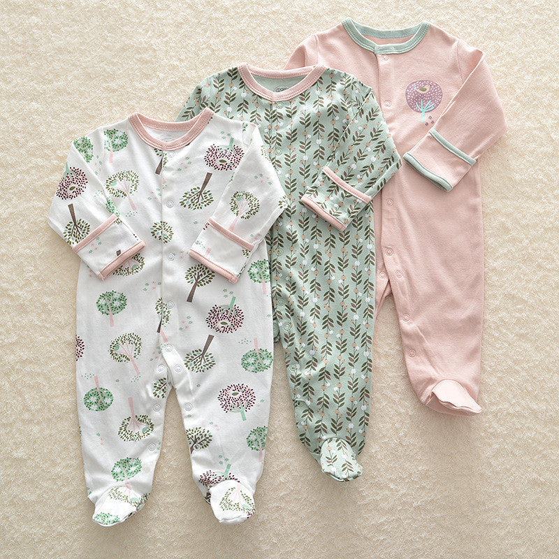 Set of three long sleeve baby onesie with nature-inspired prints and soft pastel colors for infants