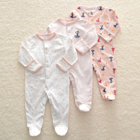 Set of three long sleeve baby onesie with pastel pink and white colors and small printed designs