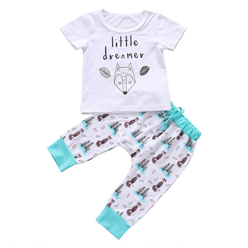 White and turquoise newborn baby clothes set with a little dreamer graphic tee and printed pants