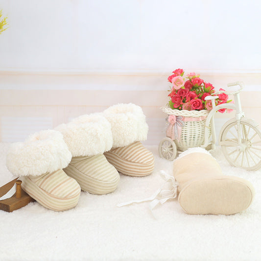 Newborn cozy print baby shoes with soft striped fabric and fluffy white lining for warmth