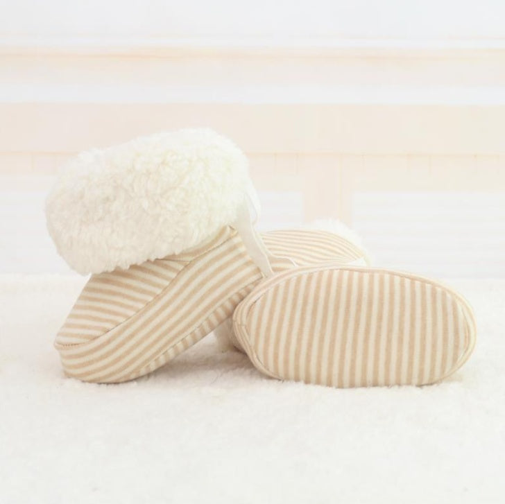Newborn cozy print baby shoes with soft striped fabric and fluffy white cuff for warmth