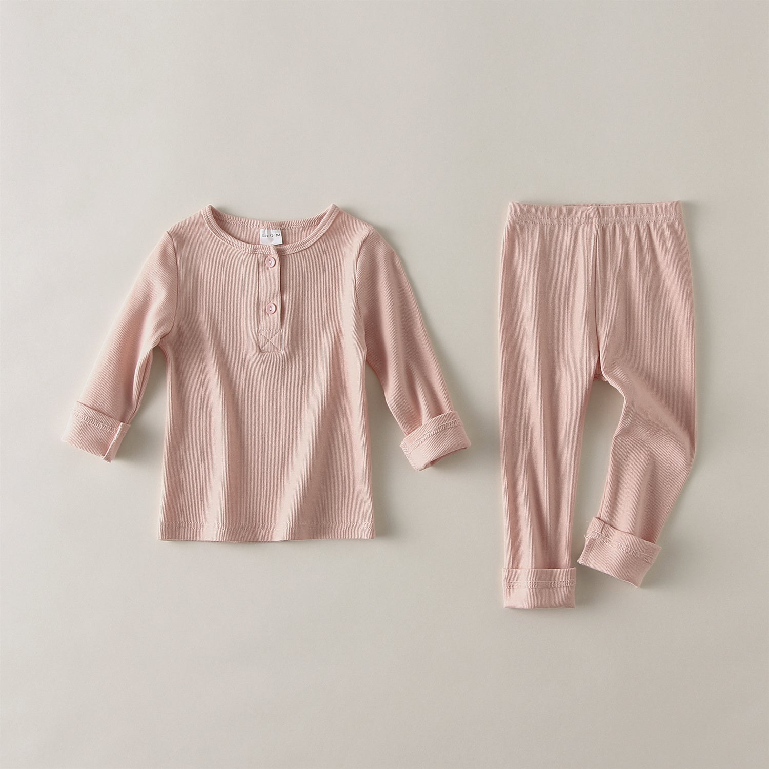Pink soft cotton pajamas for toddlers with long sleeve top and elastic waist pants