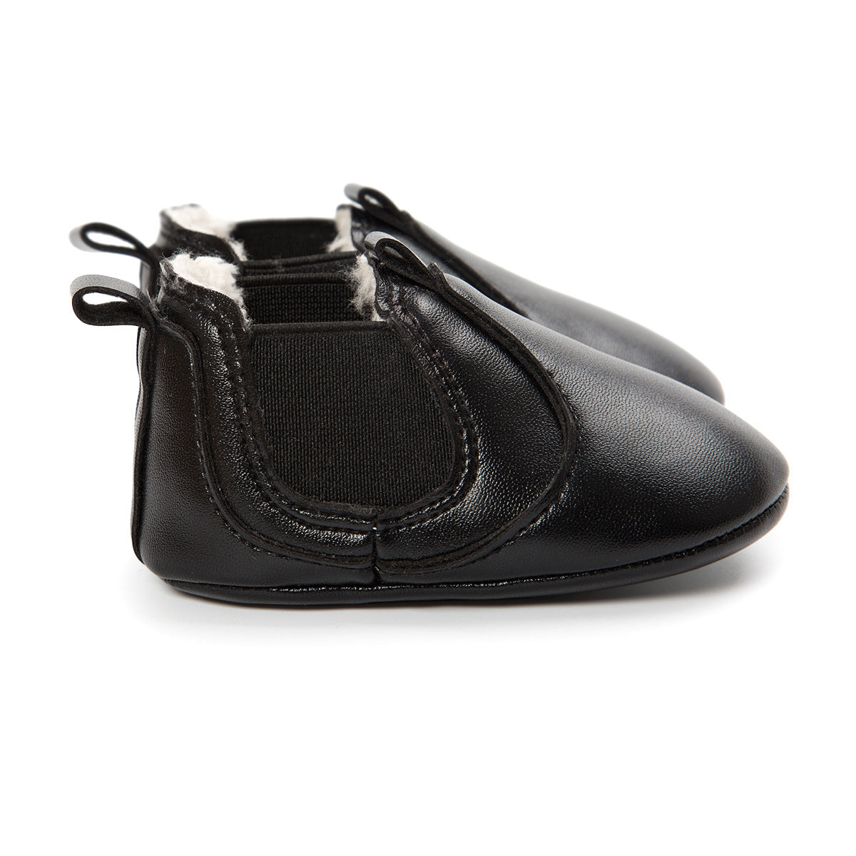Black soft sole infant shoes with elastic sides and plush lining for comfort
