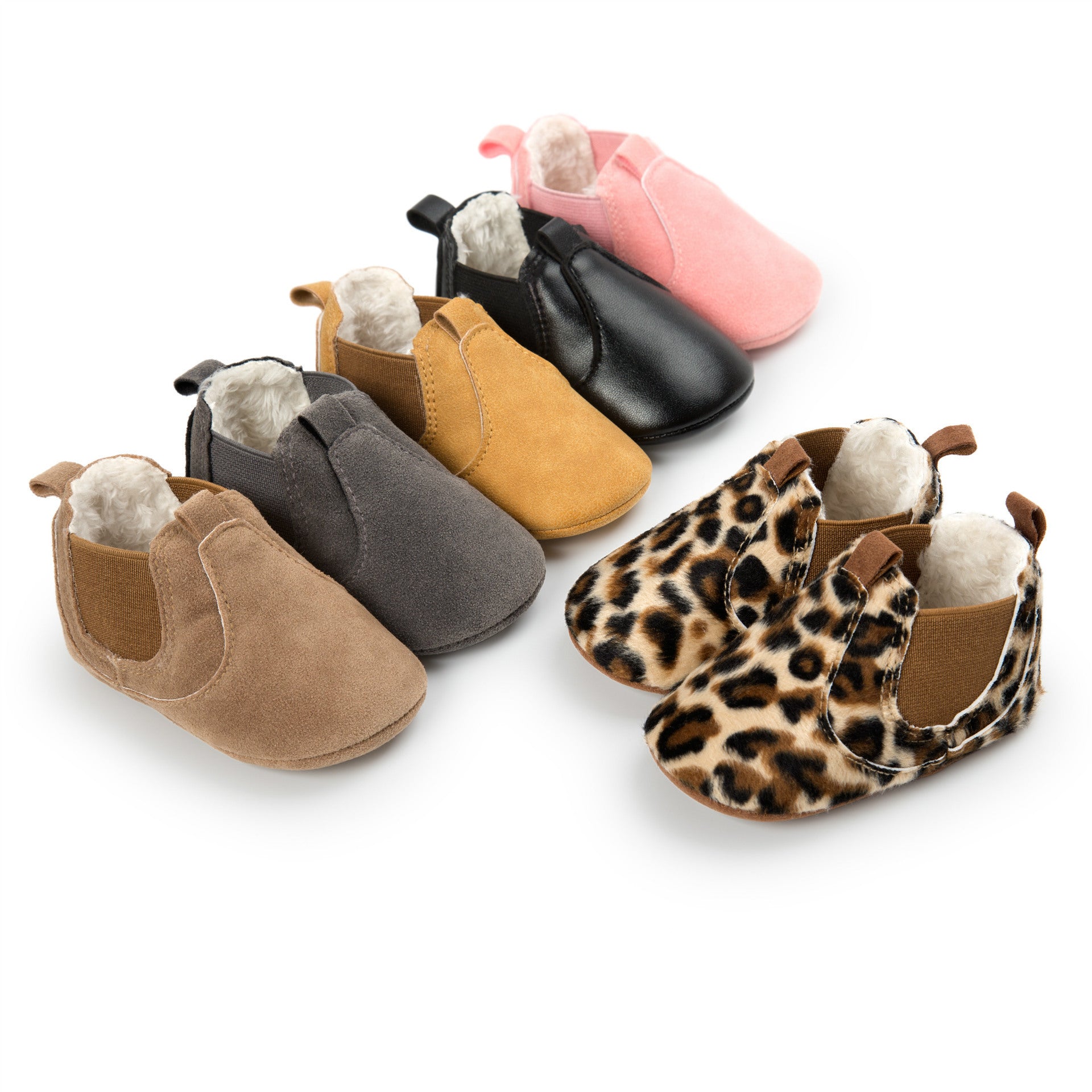 Collection of soft sole infant shoes in various colors including pink, black, tan, gray, and leopard print