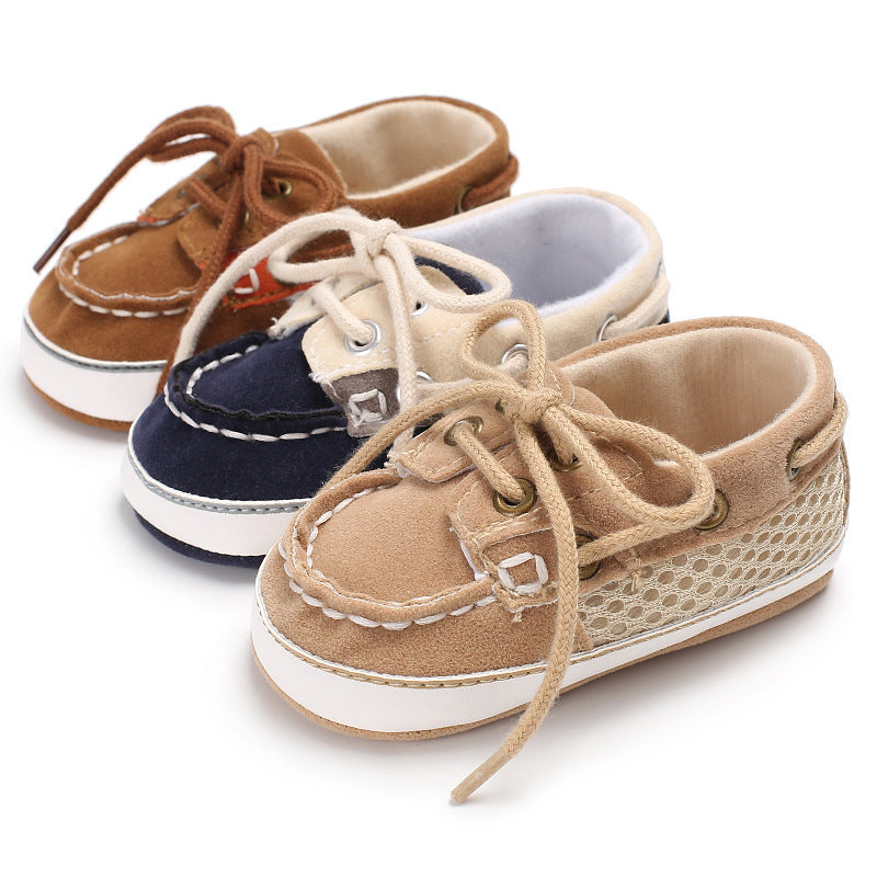 Three pairs of soft sole toddler shoes in beige, navy blue, and brown with lace-up design