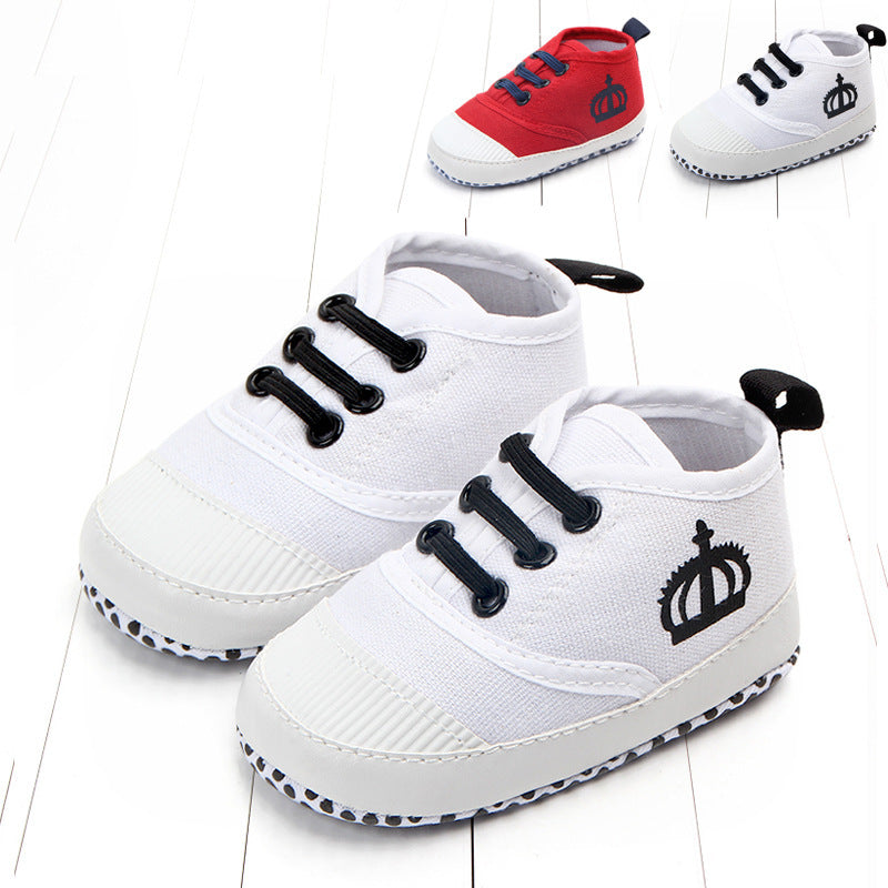 White and red toddler canvas sneakers with black crown logo and black laces for infants