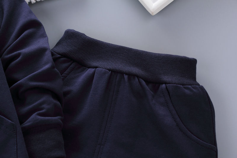 Close-up of navy blue toddler casual tracksuit showing waistband and pocket details