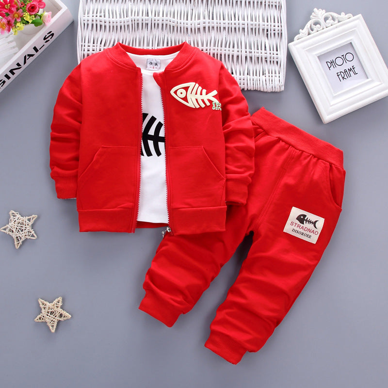 Red toddler casual tracksuit with fishbone design jacket and matching pants on gray background