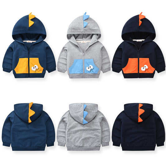 Three toddler dinosaur hoodie designs in navy, gray, and black with colorful pockets and hood spikes