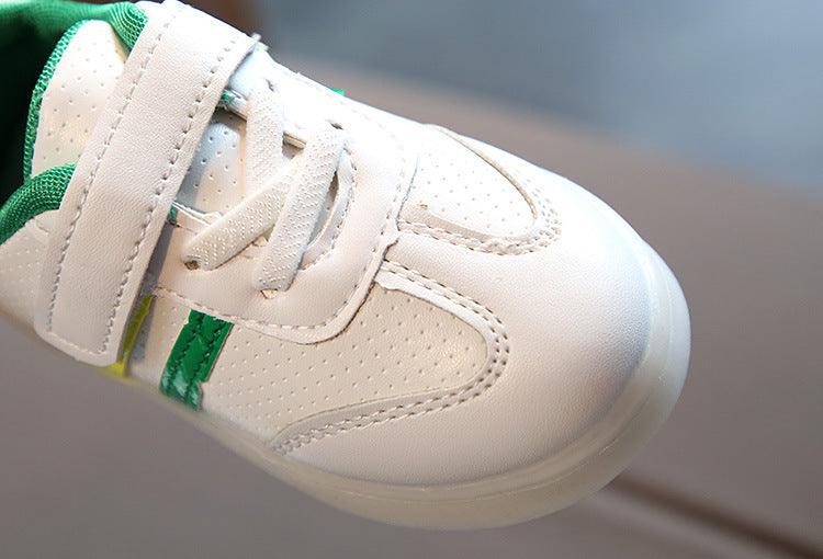 White toddler velcro light up sneakers with green accents and breathable perforated design