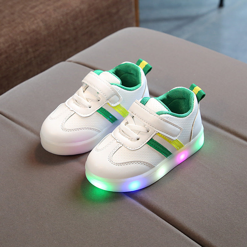 White toddler velcro light up sneakers with green and yellow stripes and colorful glowing soles