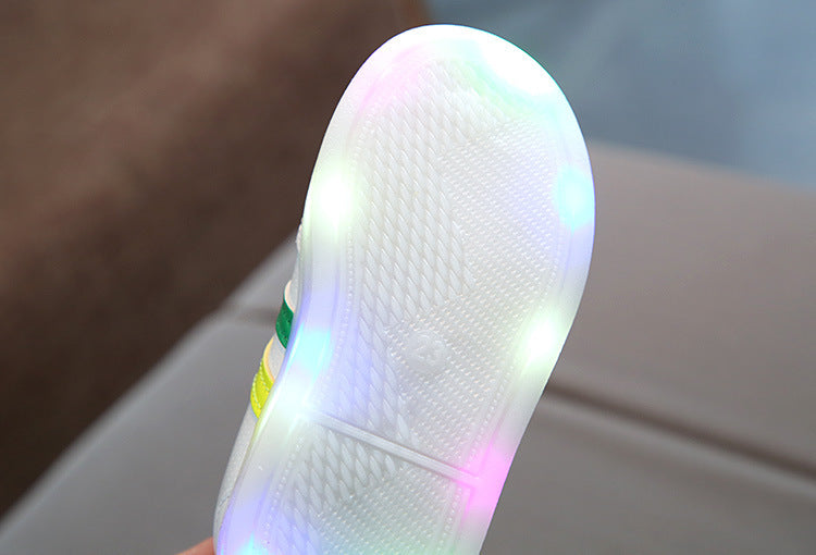 Bottom view of toddler velcro light up sneakers showing multicolor LED lights on the sole