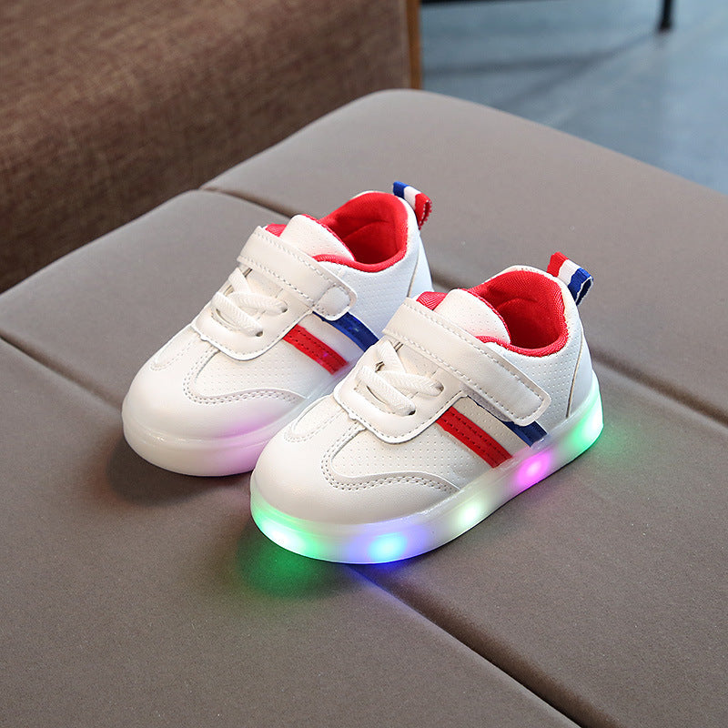 White toddler velcro light up sneakers with red and blue stripes and multicolor glowing soles