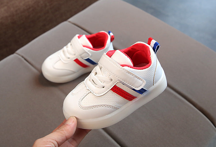 White toddler velcro light up sneakers with red and blue stripes and cushioned soles