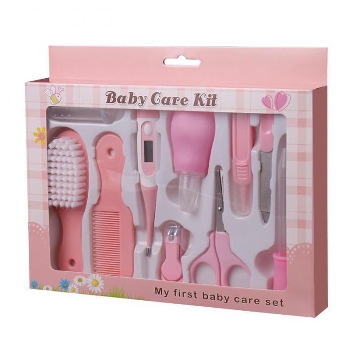 Complete baby grooming set with pink brush, comb, nail clippers, scissors, and thermometer in a baby care kit