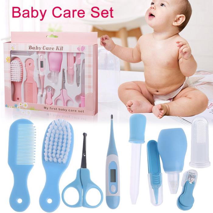 Complete baby grooming set with blue hairbrush, comb, scissors, thermometer, and other baby care tools