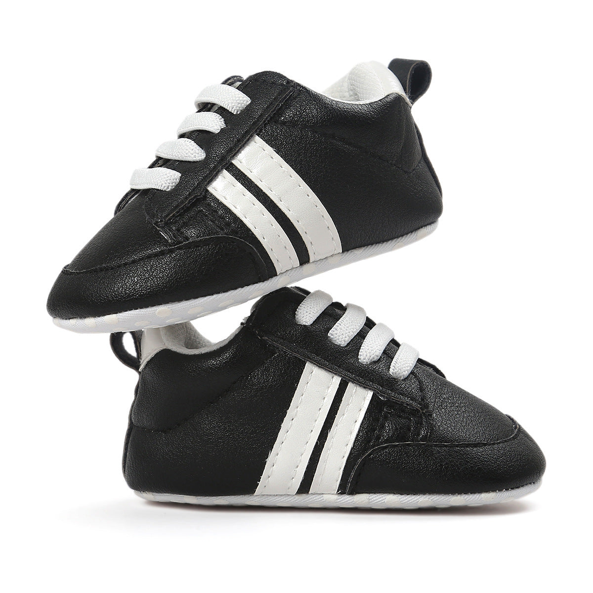 Black infant moccasin shoes with white stripes and laces designed for comfort and style