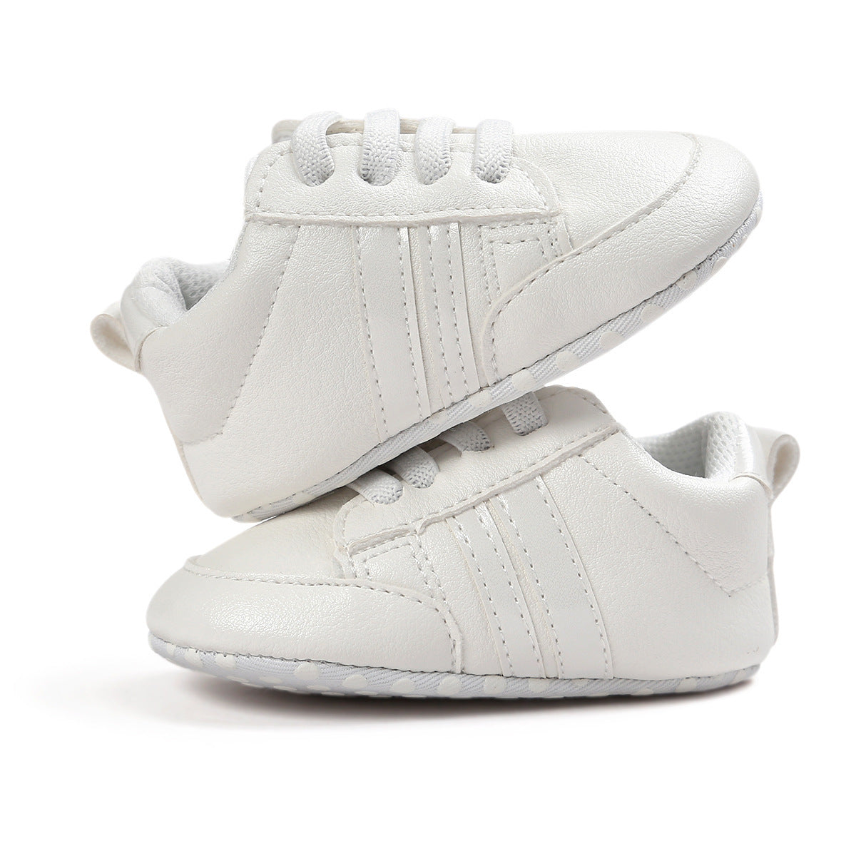 White infant moccasin shoes with soft sole and lace-up design for comfortable baby wear