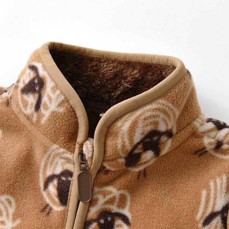 Close-up of warm baby coat for winter in brown with soft fleece lining and printed design
